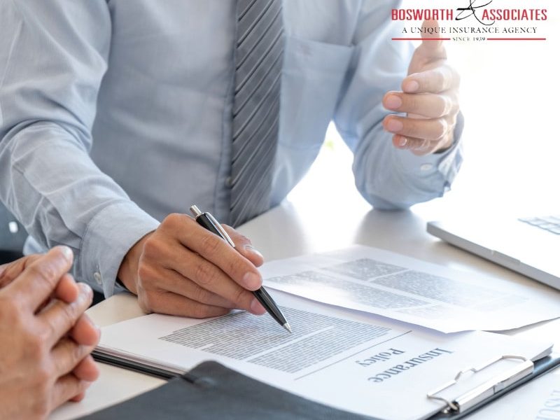 An insurance agent explaining a health insurance policy to a customer.