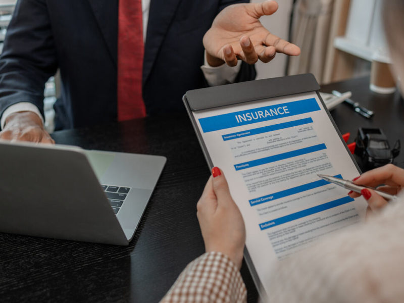 insurance agent discussing general liability insurance policy application with client